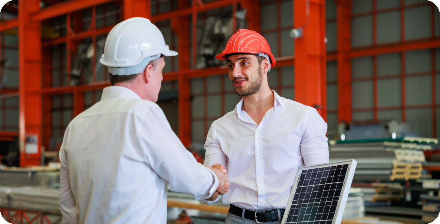 A representation of a Solar maintenance tech shaking hands with a customer. Both are wearing hard hats.